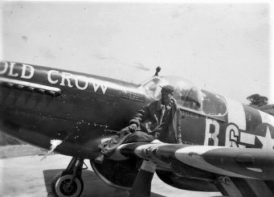 Crew-Chief-Otto-Heino-on-the-wing-of-P-51B-Old-Crow.-Note-Invasion-Stripes.jpg